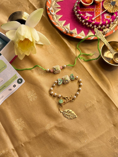 Mint Green Gold Tone Kundan Rakhi and Lumba Bracelet